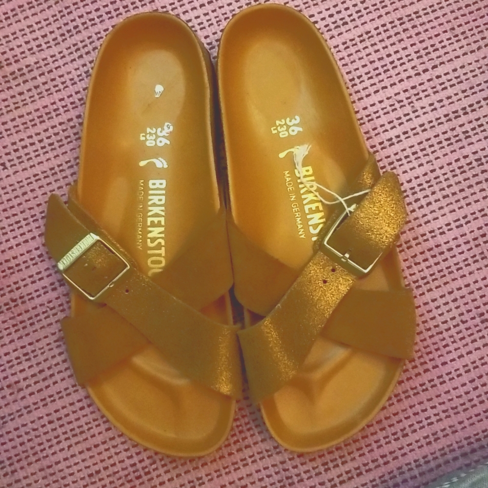 Birkenstocks sienna  Brand new. Never worn. 2 straps. Gold sparkles  and suede